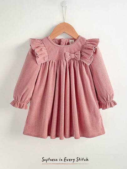 Cozy Pixies Baby Girl Solid Corduroy Ribbed Soft Long Sleeve Round Neck Ruffle Bow Decor Gathered A-Line Princess Cute Sweet Dress, Versatile & Comfortable, Suitable For Indoor, Outdoor Leisure, Skiing, Back To School, Daily Wear, Sports, Play, Autumn/Winter Dusty Pink Baby Dress Babygirl Pink Dress Baby Girl Ruffle Dress Baby Clothes Girl Flounce Sleeve Ruffles Frocks Toddler