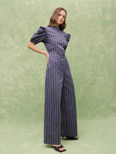 Nöista Pinstripe Jumpsuit With Ruffled Collar, Puff Sleeves, And Wide-Leg Silhouette-Polished, Feminine, And Effortlessly Chic Ideal For Carnival, Spring Summer Casual Occasion.