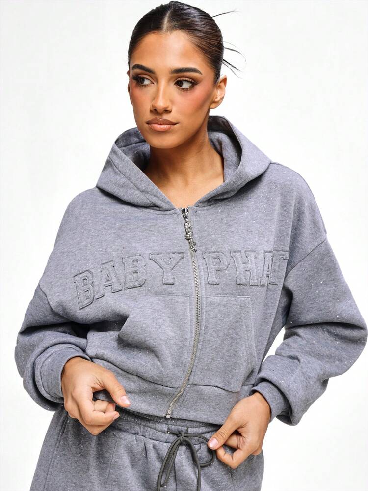 BABYPHAT Sweat-shirt-shirt zippé court avec détail de texte gaufré. Sweat-shirt-shirt en jersey gris pailleté. Pull oversize décontracté pour l'hiver et l'automne