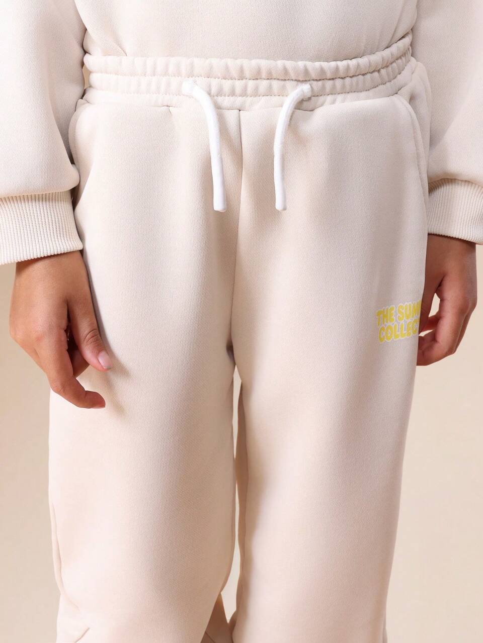 Conjunto de moletom com capuz e calça jogger com estampa de texto