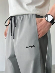Manfinity EMRG 男士休闲撞色抽绳直筒裤，宽松长款拼接黑色直筒运动裤，男士灰色喇叭运动裤，男士喇叭裤，灰色裤子，高尔夫裤，男士阔腿侧条纹健身裤 - 淺灰色 - 查看 6