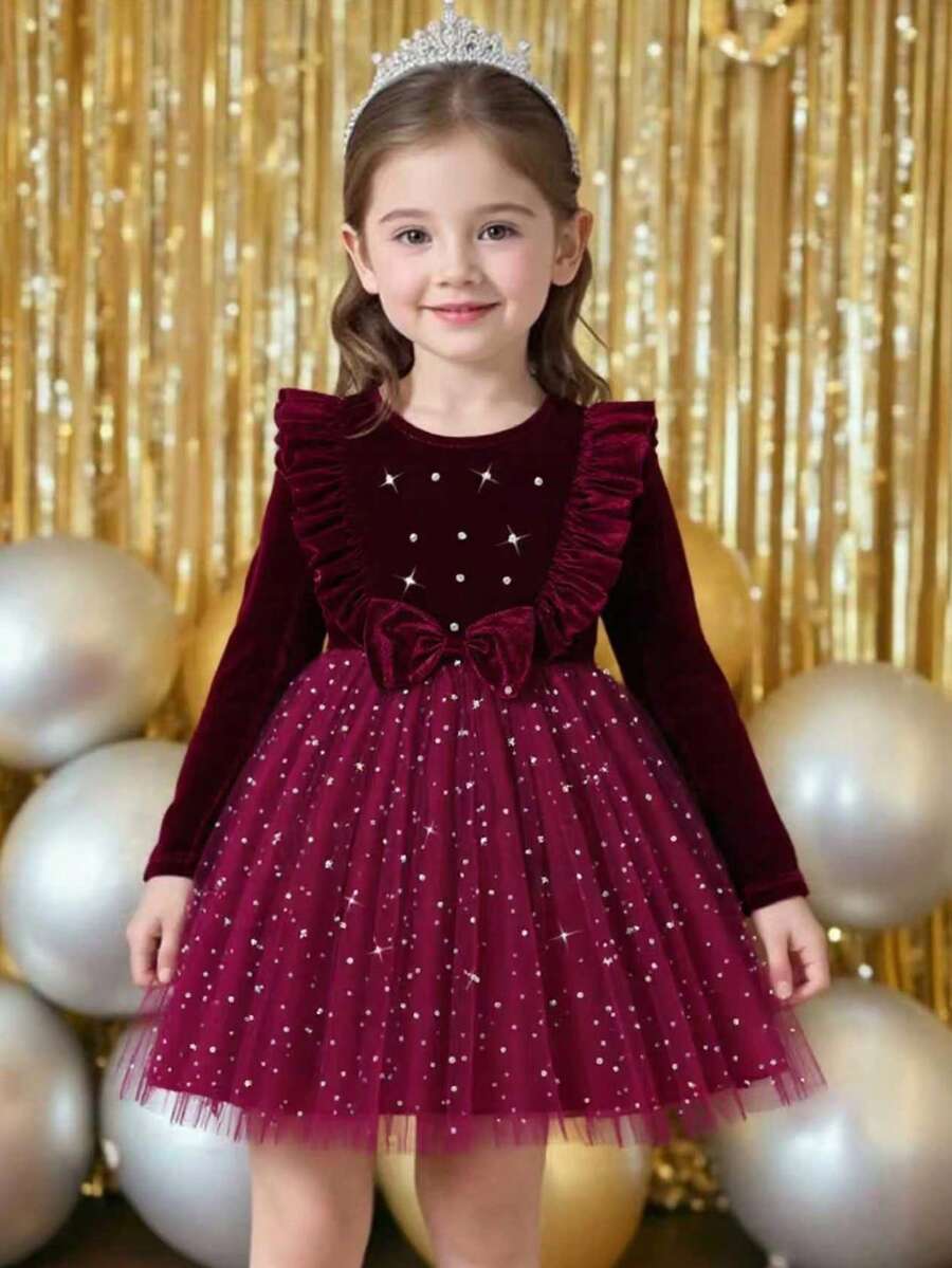 这款时尚的酒红色天鹅绒圆领长袖连衣裙,饰有荷叶边、天鹅绒蝴蝶结和串珠腰带,点缀着星星图案,采用网纱面料,A字版型,适合新年、派对、节日等场合,优雅百搭,也适合春秋季、冬季和圣诞节穿着。 - 酒紅色 - 查看 1