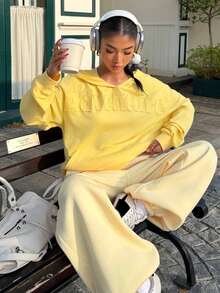 Muchica This Loose-Fitting Sweatshirt Features An Applique Letter Embroidery On The Front, A Drop-Shoulder Design, And Is Comfortable And Versatile. Suitable For Back-To-School, Autumn/Winter, Christmas, And Various Other Occasions, It's Cute, Casual, And Has, Versatile Style. A Must-Have Item For Any Capsule Wardrobe, This Creamy Yellow Christmas-Themed Sweatshirt Has A Lovely Feel. - Yellow - View 4