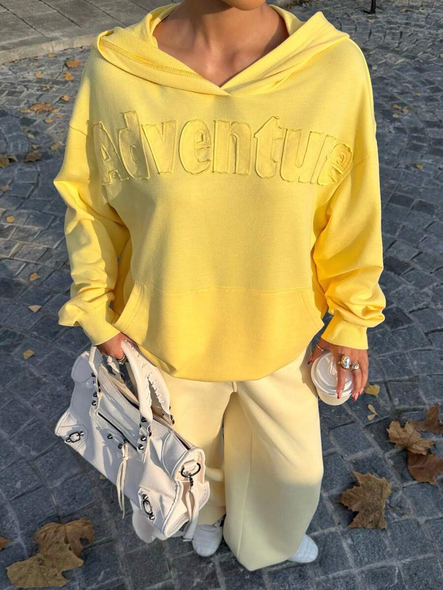 Muchica This Loose-Fitting Sweatshirt Features An Applique Letter Embroidery On The Front, A Drop-Shoulder Design, And Is Comfortable And Versatile. Suitable For Back-To-School, Autumn/Winter, Christmas, And Various Other Occasions, It's Cute, Casual, And Has, Versatile Style. A Must-Have Item For Any Capsule Wardrobe, This Creamy Yellow Christmas-Themed Sweatshirt Has A Lovely Feel. - Yellow - View 1