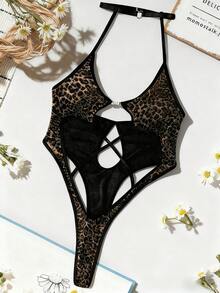 SHEIN Bộ đồ liền thân hở lưng lấy cảm hứng từ họa tiết báo bằng vải dệt kim cho vẻ ngoài táo bạo và quyến rũ. Vải lấp lánh là món đồ không thể thiếu cho những bữa tiệc lộng lẫy, đi chơi. - màu đen - Xem 1