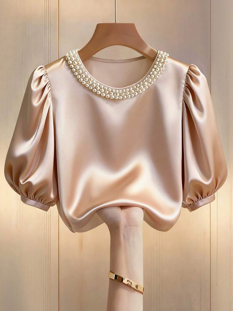 Franclia Women's New Summer Fashion Sweet Design Champagne Color, Satin Satin Fabric With Beaded Pearl Embellishments, Round Neck Short Sleeve Casual Puff Sleeve Women's Shirtwinter For Women,Christmas,New Year ,White For New Year's Eve,Party,Beach,Elegant,Casual,Casual For Women,Romance, Valentine's Day, Dating,Summer,Women's Beach Bikinis Summer 2026,Summer Tops,Graduation Season Attire, Fashionable Casual Commuter Wear, Business Office Wear, Versatile And Stylish Everyday Casual Wear, Urban Teacher's Professional Attire