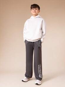 SUMWON Tween Boys Relaxed Fit Graphic Sweatpants With Sport Label Patch And Urban Essentials Leg Text Vacation - Dark Grey - View 3