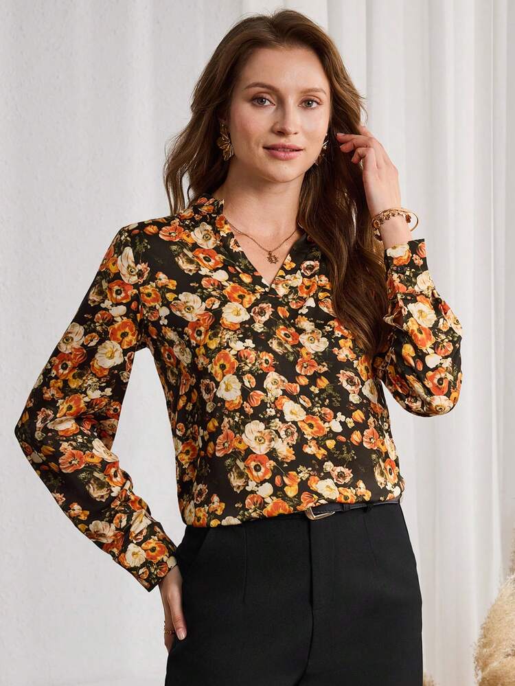 This Elegant Women's Blouse Features A Deep, Calming Dark Green Base Adorned With Warm Orange-Yellow Floral Patterns, Perfectly Capturing The Festive Spirit Of The New Year. The Floral Design Is A Vibrant, Warm-Toned Floral Pattern, Exuding A Bright And Lively Yet Stylish Feel. The V-Neck, Long-Sleeved, Loose-Fitting Design Is Made Of Lightweight Material, Offering A Sense Of Movement And A Comfortable, Slimming Silhouette. Suitable For Spring And Autumn, It Can Be Paired With Black Trousers For A Sharp Look During The New Year, Or Layered With A Jacket For Added Depth. Perfect For Both Work Commutes And Casual Gatherings, This Blouse Brightens Up The Work Atmosphere With Its Warm Floral Pattern And Showcases A Bright And Fashionable Taste At Small Dinner Parties. It's A Versatile Piece That Combines Energy And Practicality In Your New Year's Wardrobe.