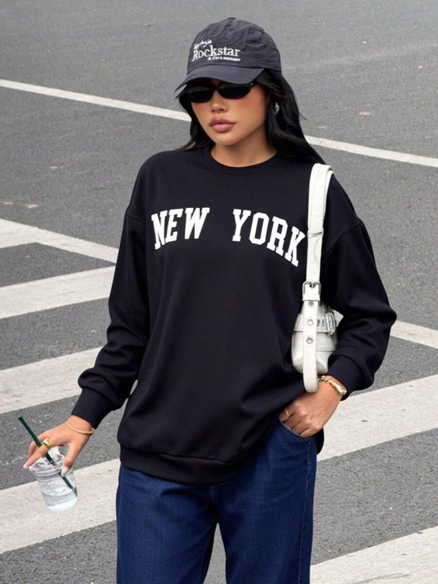 SHEIN Moletom feminino adolescente casual com estampa de slogan em letras, gola redonda, manga longa, cor sólida, peça básica e versátil, ideal para ir ao trabalho, escola, uso diário, viagens, festas ao ar livre, esportes e outono/inverno. Moletom de Nova York para jovens. - Azul marinho - Ver 1