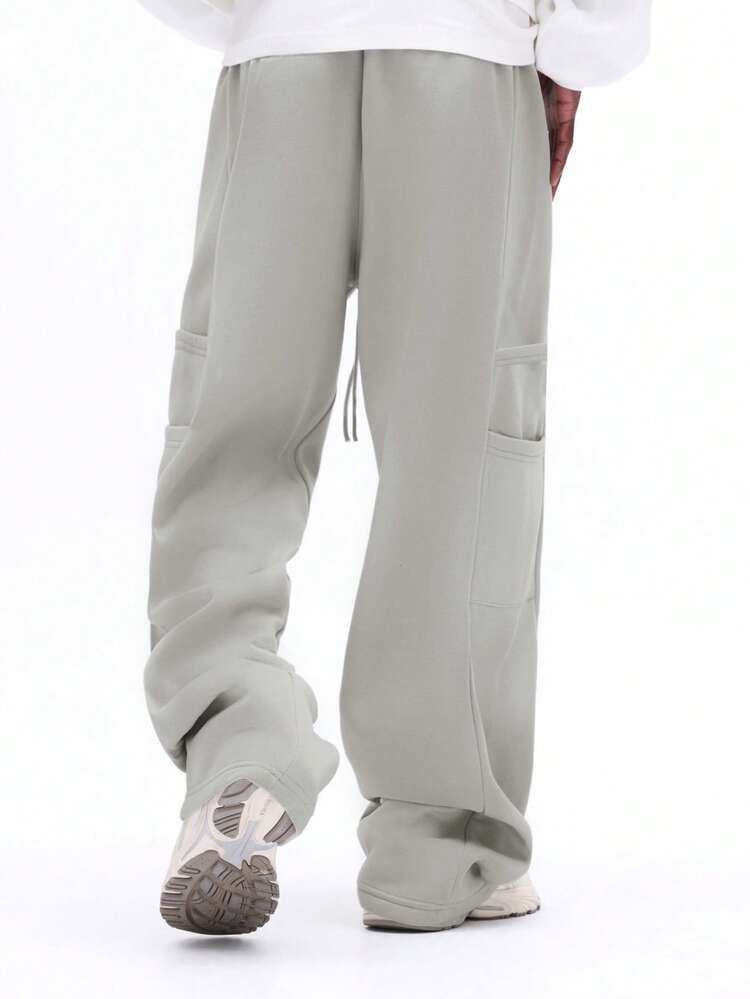 Weit geschnittene, plissierte, bestickte Jogginghose mit Seitentaschen