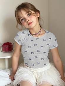 SHEIN Áo thun tay ngắn cổ tròn nhún bèo in nơ hồng mini thoải mái cho bé gái tuổi teen, phù hợp cho mùa hè - Nhiều màu - Xem 4