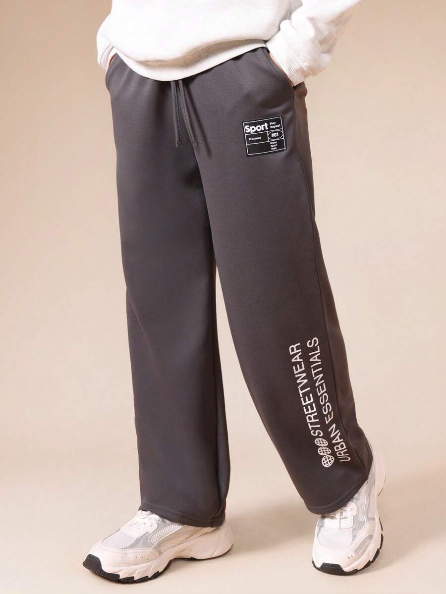 SUMWON Tween Boys Relaxed Fit Graphic Sweatpants With Sport Label Patch And Urban Essentials Leg Text Vacation - Dark Grey - View 1