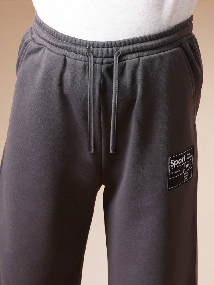 Pantaloni della tuta grafici con toppa con etichetta sportiva