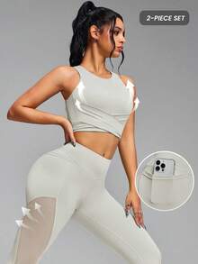 Innovista Bộ đồ thể thao nữ màu trơn không lưng, thiết kế buộc dây và quần legging nhún bèo, thích hợp cho yoga, chạy bộ. Bộ đồ thể thao màu trắng thiết yếu dành cho nữ – Áo croptop không tay với thiết kế dây buộc và các mảng lưới + Quần legging nâng mông với túi đựng điện thoại/thẻ và các đường phối lưới thoáng khí | Bộ đồ thể thao hai mảnh co giãn thoải mái cho yoga, pilates, đạp xe, HIIT, chạy bộ, tập luyện trên bãi biển và tập luyện hàng ngày từ văn phòng đến phòng tập | Bộ đồ thể thao tối giản, chất liệu cao cấp thoải mái, nâng đỡ tốt và nhanh khô. - Màu Khaki - Xem 2