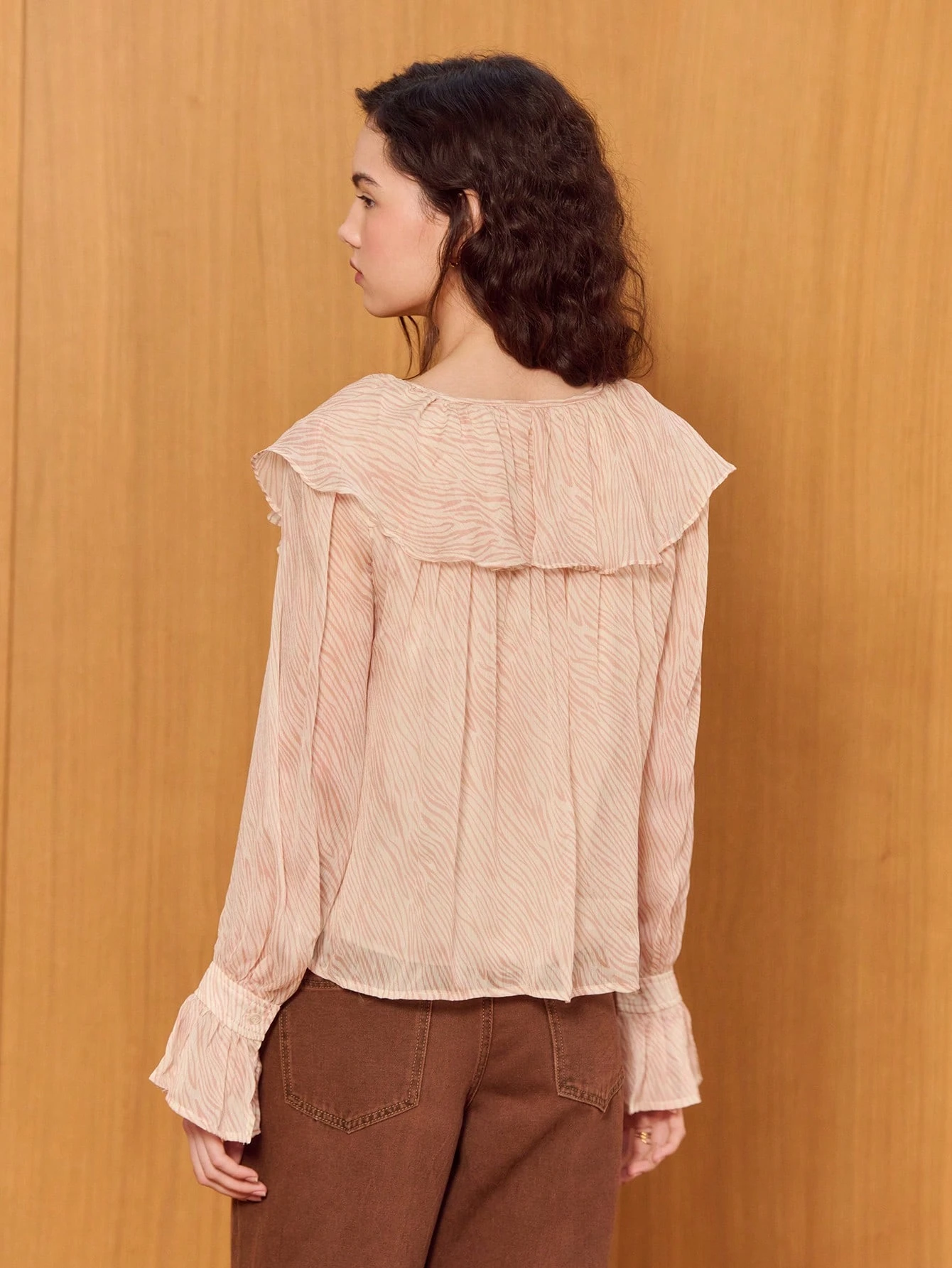 Feminine Pink Zebra Ruffle Top With Flared Long Sleeves