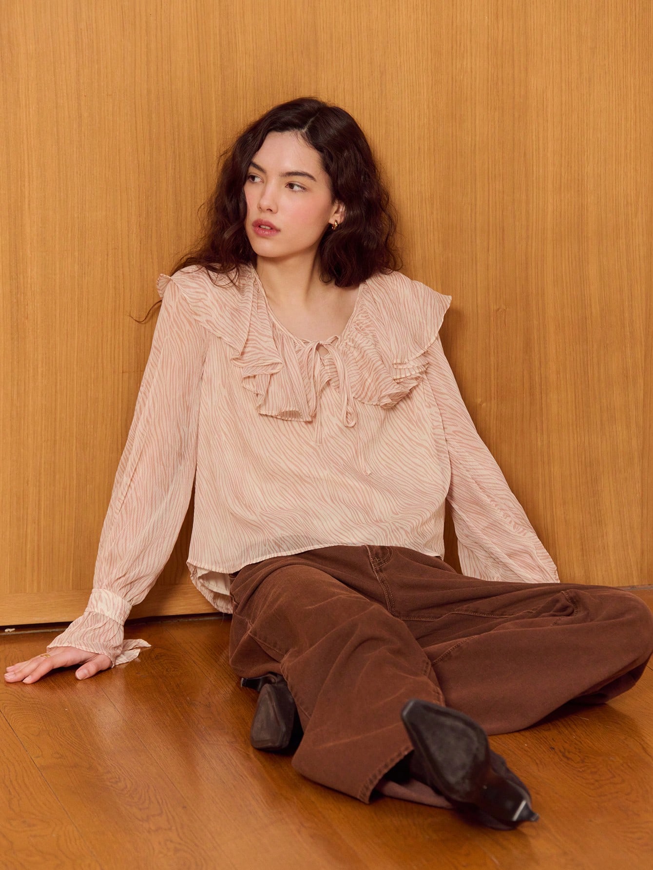 Feminine Pink Zebra Ruffle Top With Flared Long Sleeves