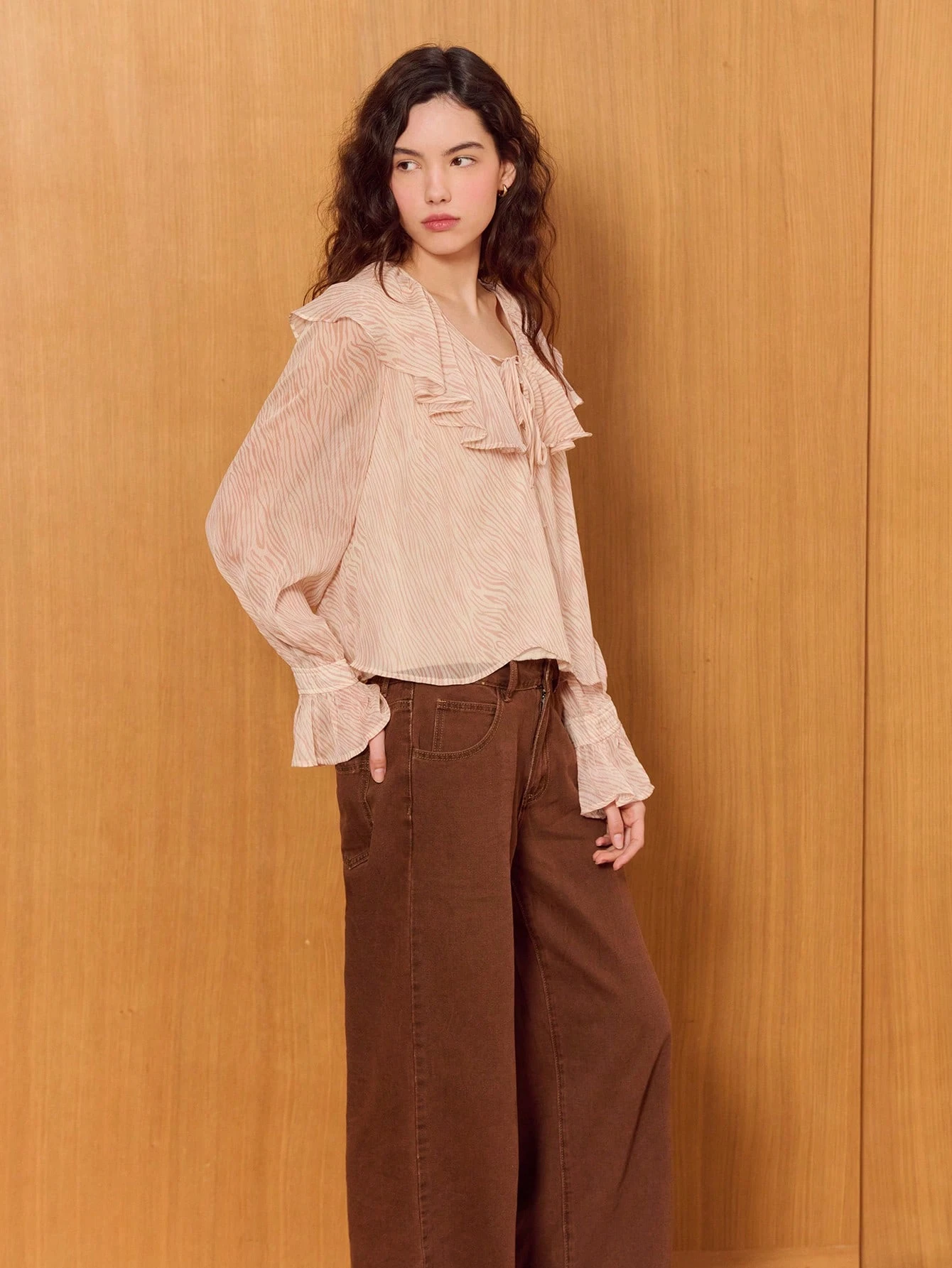 Feminine Pink Zebra Ruffle Top With Flared Long Sleeves