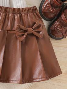 Elladie kids Top tricotat cu dungi, guler rotund, mânecă lungă, pentru fete tinere, cu fundă 3D + fustă plisată cu fundă 3D din PU maro, la modă și confortabilă, plină de viață și drăguță, potrivită pentru casă, joacă și alte ocazii