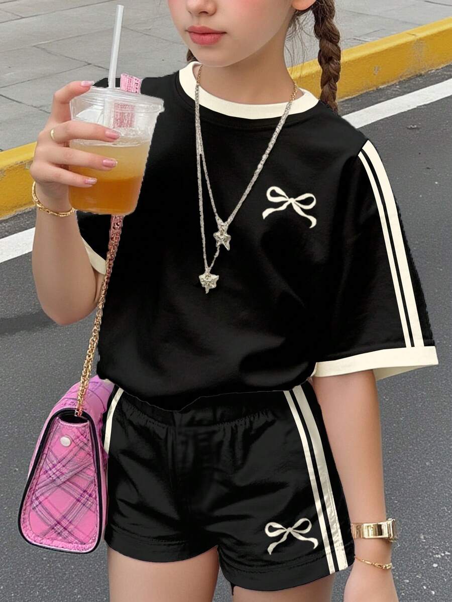 SHEIN Leap Crew 2 件套青少年女孩休闲黑色迷你蝴蝶结装饰，撞色奶油色条纹短袖圆领 T 恤和短裤套装，适合夏季、秋季服装，轻松舒适，儿童秋季分层装，时尚女孩，休闲装，儿童图案服装，返校，秋季服装，返校节 - 彩色 - 查看 1