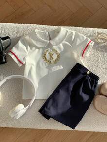 SHEIN 2pcs Baby Boy Preppy Style Embroidered Pattern Peter Pan Collar Short Sleeve Shirt & Elastic Waist Shorts Gentleman Outfit Set, Suitable For Birthday Party, Rave, Evening Party, Performance, Wedding, Baby Shower, And 1st Birthday Celebration Baby Boy Summer Outfit Baby Boy Casual Shorts Baby Boy Sailor Outfit Baby Boy Short Sleeve Set Baby Boy White Polo - Multicolor - View 7