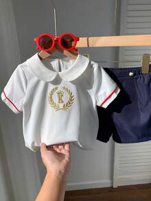 SHEIN 2pcs Baby Boy Preppy Style Embroidered Pattern Peter Pan Collar Short Sleeve Shirt & Elastic Waist Shorts Gentleman Outfit Set, Suitable For Birthday Party, Rave, Evening Party, Performance, Wedding, Baby Shower, And 1st Birthday Celebration Baby Boy Summer Outfit Baby Boy Casual Shorts Baby Boy Sailor Outfit Baby Boy Short Sleeve Set Baby Boy White Polo - Multicolor - View 10