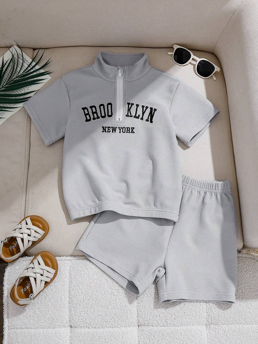 两件套针织华夫格纹理半拉链前开襟刺绣英文文字短袖上衣和短裤，时尚休闲日常穿着