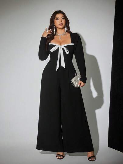 Viva Relle جمبسوت قفزة مع ياقة قلب وأكمام طويلة وساق واسعة مصنوعة من الأقمشة المحبوكة مع ربطة عنق للمرأة ذات الحجم الكبير