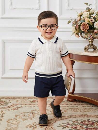 Souflis Souflis 2pcs Baby/Toddler Boys' Solid Light Apricot Knit Jacquard Polo Collar Half-Placket Top & Matching Navy Stripe Hem Polo Collar Short Sleeve Shirt With Navy Shorts, Gentleman Style Outfit, Suitable For Casual Daily Wear, Spring/Summer, 6M-3T Baby Boy Party Wear Preppy Baby Boy Clothes