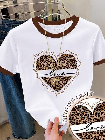 Resyla Camiseta casual de mujer con estampado de leopardo, patrón de corazón y bloqueo de color en cuello redondo