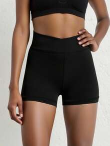 少女高腰骑行短裤，交叉腰带设计，纯色面料，防蹲穿四向弹力，适合跑步、骑行和训练。