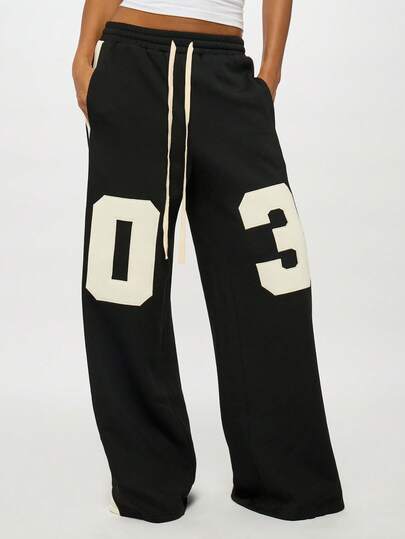 SUMWON Plus Size Drawstring Waisted Wide Leg Sweatpants With Large Number Print Graphics