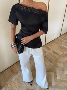 Siren Gaze Elegant Black Satin Top With An Off-The-Shoulder Neckline And Lace Trim. This Short-Sleeved, Asymmetrical Hem T-Shirt Features A Slimming And Flattering Silhouette, Making It A Stylish And Versatile Choice For Both Work And Casual Wear. Summer - Black - View 3