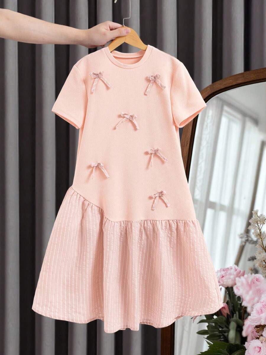 Váy kẻ sọc cổ tròn tay ngắn màu trơn trang trí nơ cho bé gái tuổi mới lớn - Màu Hồng baby - Xem 1