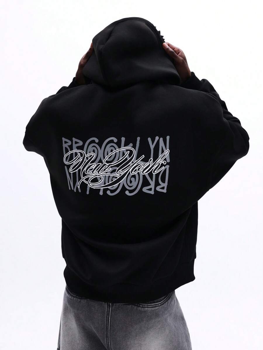 SUMWON 男士宽松黑色套头连帽衫，带中央口袋和抽绳帽，适合休闲冬季街头穿着 - 黑色 - 查看 1