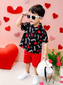 2pcs Toddler Boys Gentleman Outfit Set, Including Black Woven Digital Print Short Sleeve Shirt With "Love", Heart And Crown Patterns, Collar And Button Design, And Red Shorts. Vibrant Colors, Suitable For Casual Wear Or Performances To Showcase Children's Innocence And Vitality.Valentine's Day - Black - View 1