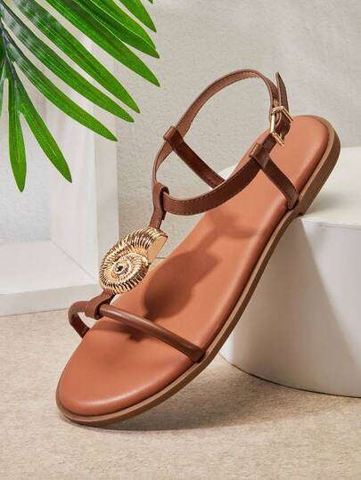 SHUZIA #ResortChic Women's Gold Nautilus Shell Decor T-Strap Vegan Leather Chocolate Flat Sandals–Elegant, Minimal & Vacation-Ready.
