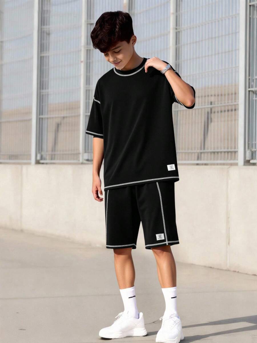 Vacaura 2件套青少年男童纯色简约圆领短袖针织T恤搭配短裤,撞色线条设计,面料舒适,适合所有季节和场合。 - 黑色 - 查看 1