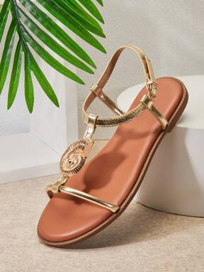 SHUZIA Women's Gold Nautilus Shell Decor T-Strap Metallic Pu Gold Flat Sandals–Elegant, Minimal & Vacation-Ready.