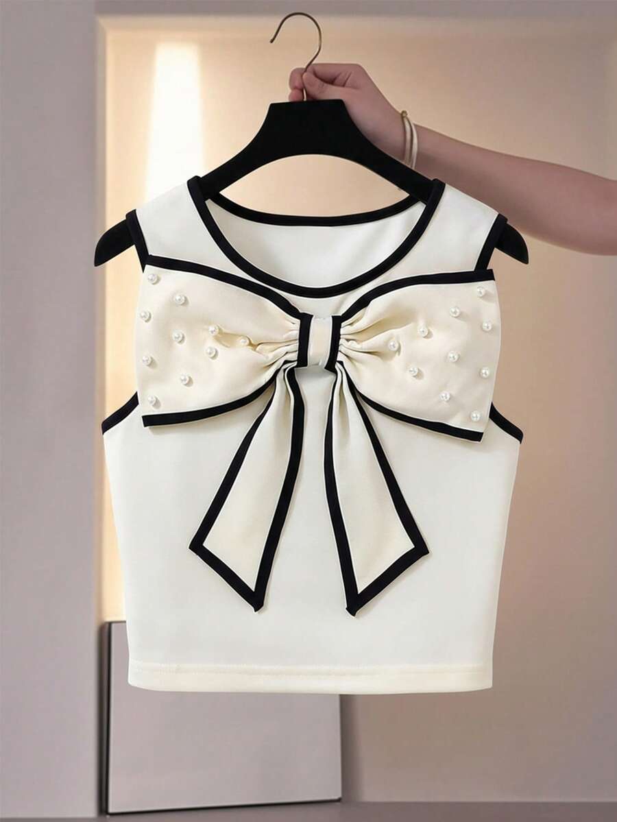 SHEIN 时尚休闲珍珠蝴蝶结可拆卸撞色滚边无袖上衣，适合少女夏季旅行、度假、海滩和户外活动穿着。 - 杏色 - 查看 1