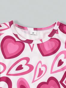 两件套女童休闲日常棕色蝴蝶结短袖T恤和黑色喇叭裤，可爱活泼的夏季套装