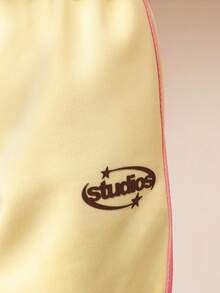 Conjunto de camiseta corta y pantalón ancho tipo jogger con logo de la Liga Atlética de Milán SUMWON para uso casual en primavera y verano, ideal para vacaciones - Amarillo - Ver 7