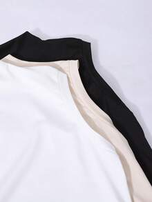 Conjunto de três peças com top sem mangas de gola alta para meninas adolescentes, com um colete de malha ajustado. Esta camiseta interior sólida e elástica é projetada para um ajuste personalizado e pode ser usada tanto como uma camada inferior quanto sozinha para estilos de sobreposição diários.