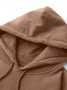 Mujer Una sudadera con capucha de color liso y corte holgado, ideal para el uso diario y actividades informales, y apropiada para todas las estaciones. - Marrón - Ver 9