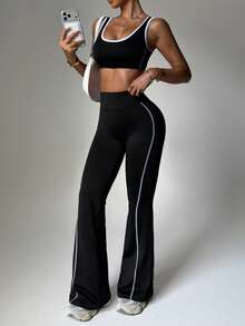 Dewbera مجموعة ملابس رياضية للنساء 2 قطعة، حمالة صدر رياضية بأكتاف قابلة للإزالة وألوان متباينة، وبنطلون ثلاثي الأرباع بخصر مخطط بألوان متباينة مع طباعة جرافيك، مناسبة للاستخدام اليومي والجري والرياضة واليوغا والجيم والتنس وغيرها. - الأسود - مشاهدة 6