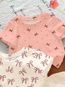 SHEIN LMoss Kids 3件套女婴休闲柔软舒适圆领短袖T恤，蝴蝶结图案系列，颜色包括奶油白、奶油米色、奶油粉，适合春夏日常、居家、户外、学校、度假穿着。 - 彩色 - 查看 5