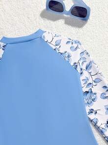 SHEIN 女童长袖印花连体泳衣，适合水疗中心、度假村和海滩穿着。