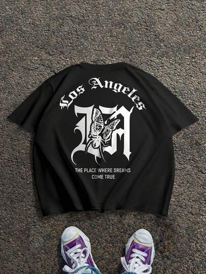 Manfinity LEGND Camiseta casual de manga corta con cuello redondo, estampado de lema y mariposa, versátil para hombres