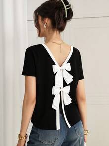 Gloray Camiseta de mujer con cuello redondo y manga corta, con decoración de lazo en la espalda