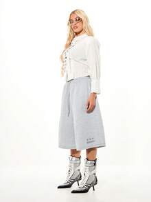 SUMWON WOMEN Oversized Power Shoulder Pinstriped Button Front Long Sleeve Blouse With Eyelet Waist Tie Detail For Casual Professional Wear - White - View 3