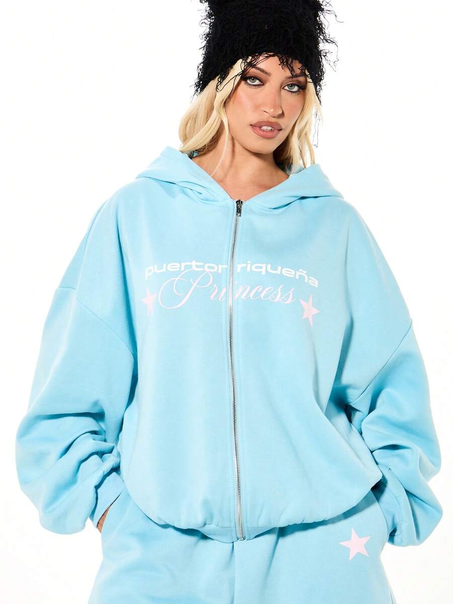 SUMWON WOMEN Áo hoodie dáng rộng màu xanh dương có khóa kéo, in hình công chúa Puerto Rico và điểm nhấn ngôi sao, tạo phong cách đường phố thường ngày. - Màu xanh lam - Xem 1